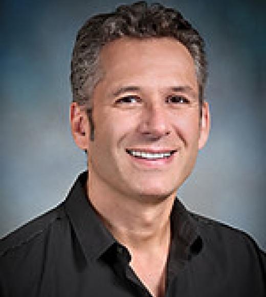 A professional headshot of Dr. Konstantinos Zarbalis.